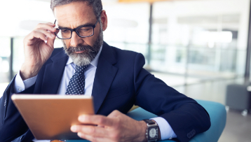 a man looking at his anbtx liquidity management accounts